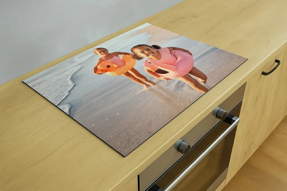 Uiteraard print fotogeschenk ook jouw eigen foto op onze inductiekookplaatbeschermers.